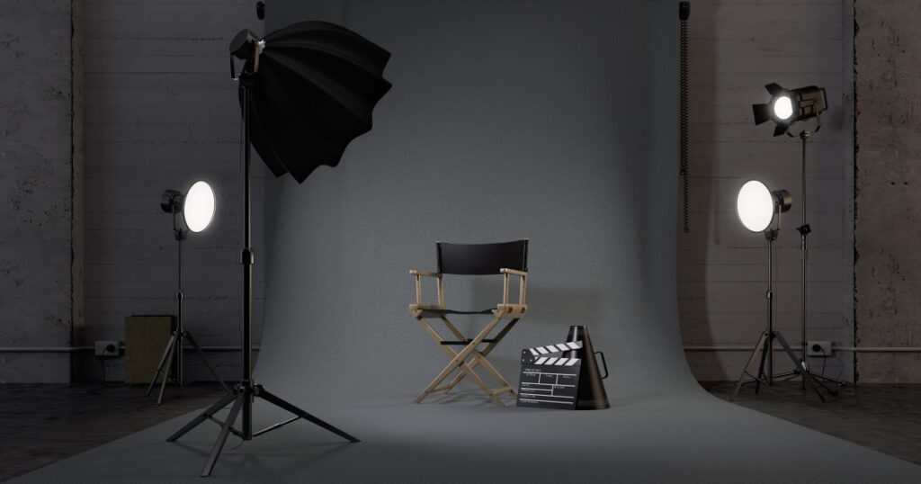 Director's chair and lighting for studio casting session.