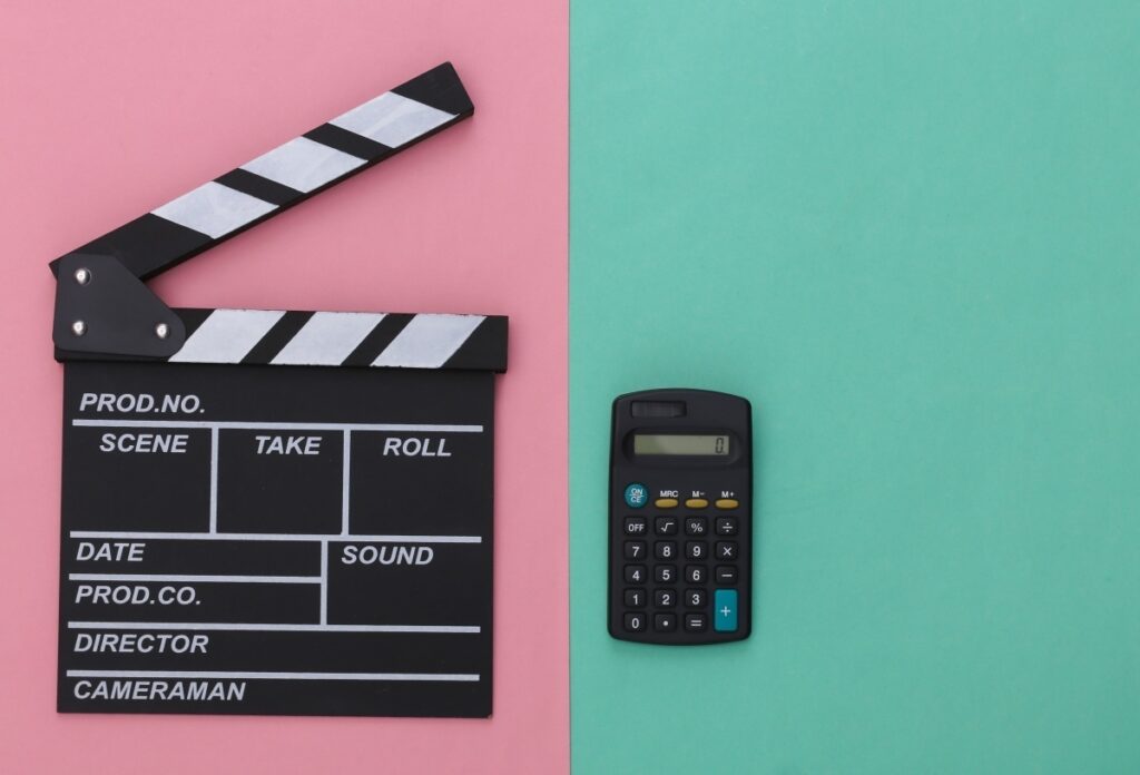 Clapperboard and calculator for film budgeting