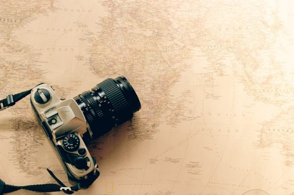 Vintage camera for film location scouting on world map